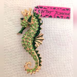 Elegant Gold Seahorse Brooch with Pink Tag